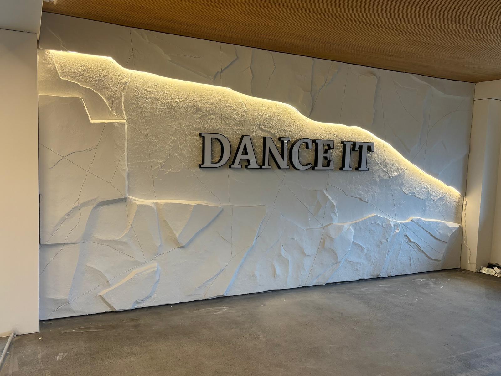 Branded stone feature wall installation