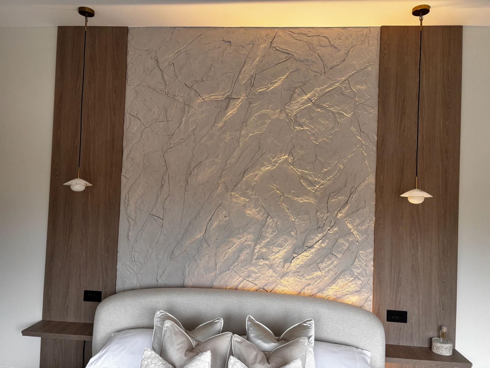Backlit stone feature wall in luxury bedroom